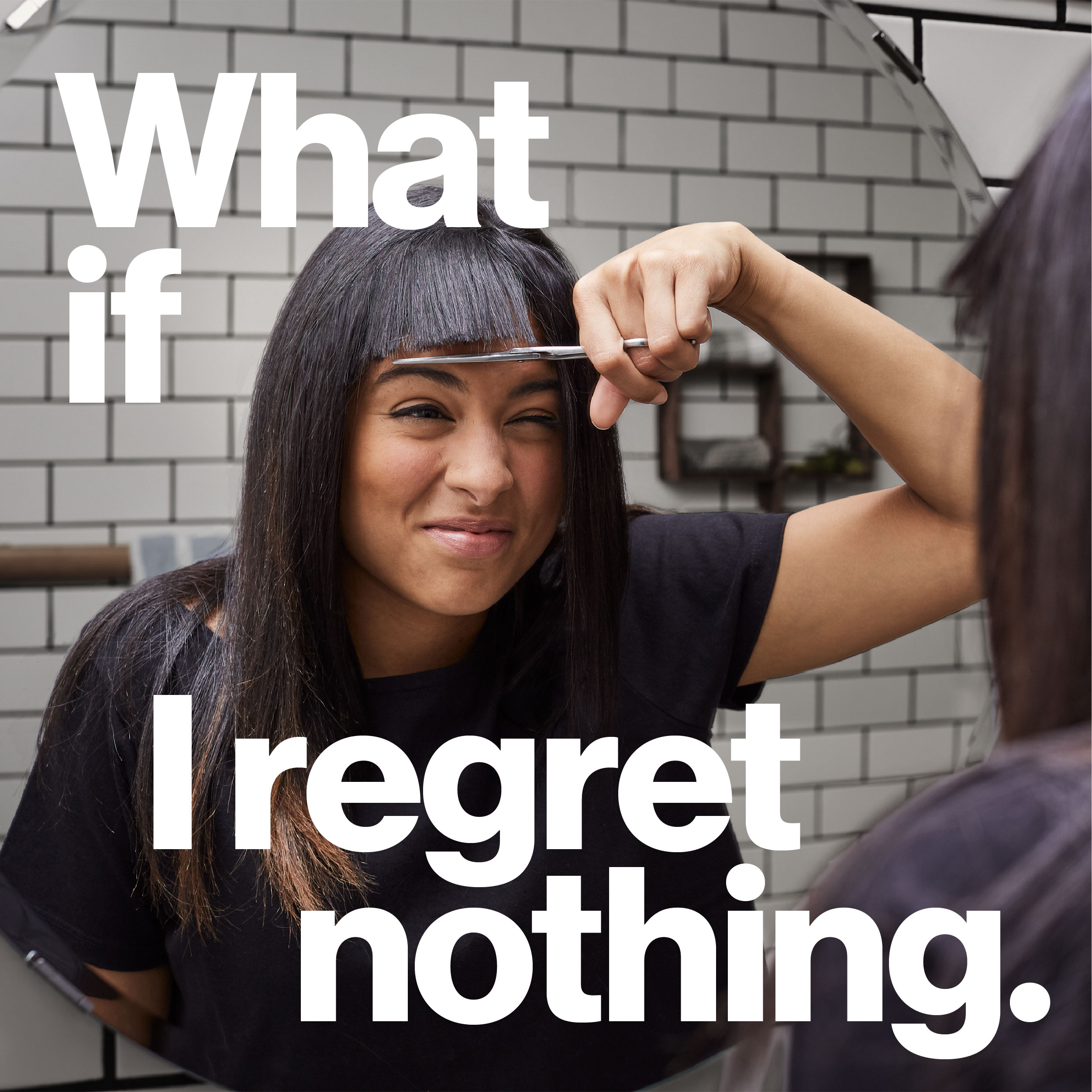 Woman cutting her own bangs.