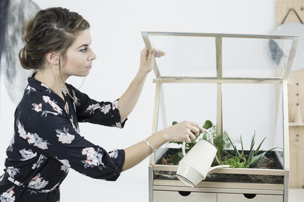 Woman watering plants.