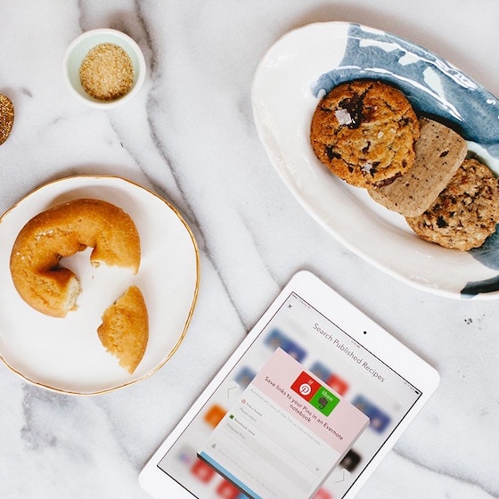 Pinterest app on tablet on table with pastries.
