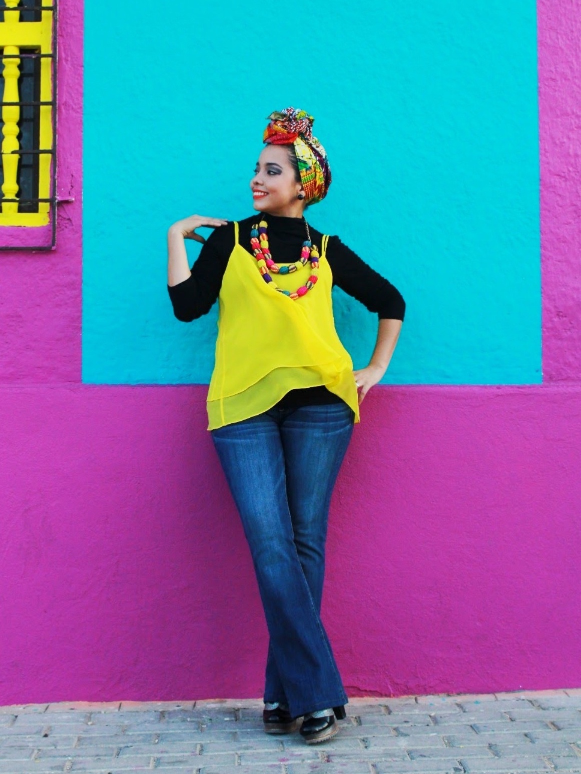 Photo of woman in jeans and yellow top