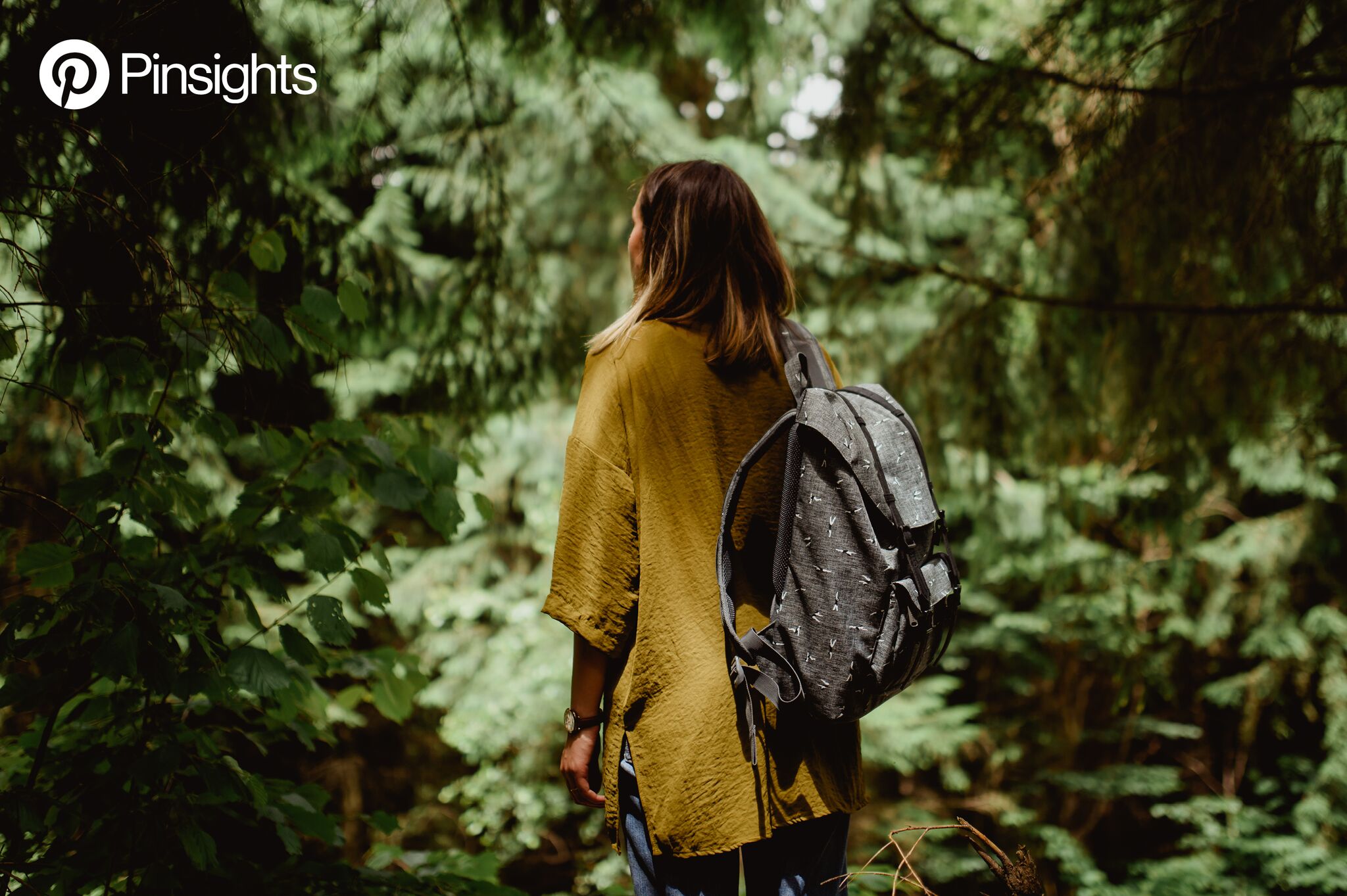 Woman in mustard shirt in the forest