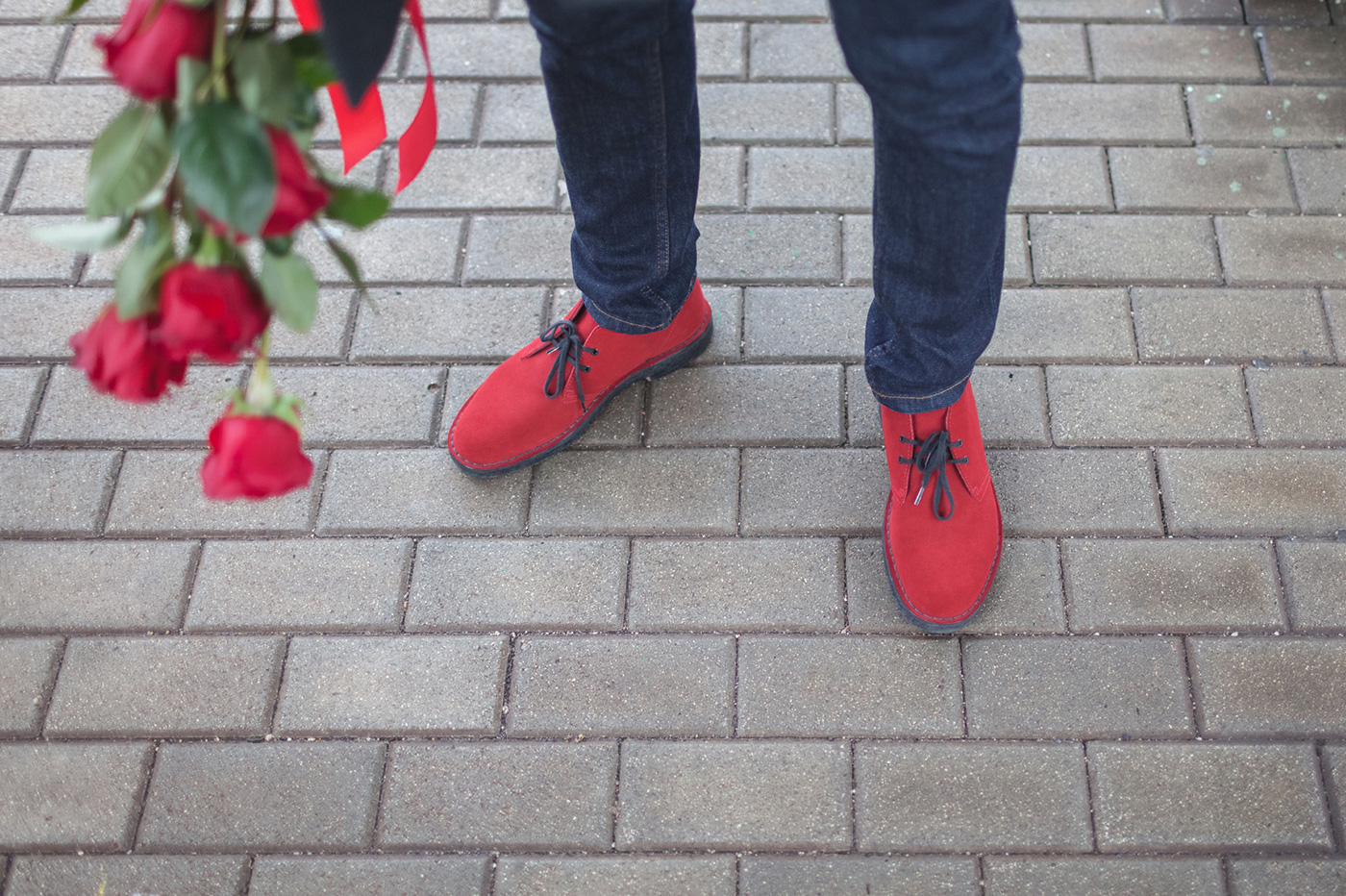 Person holding roses.